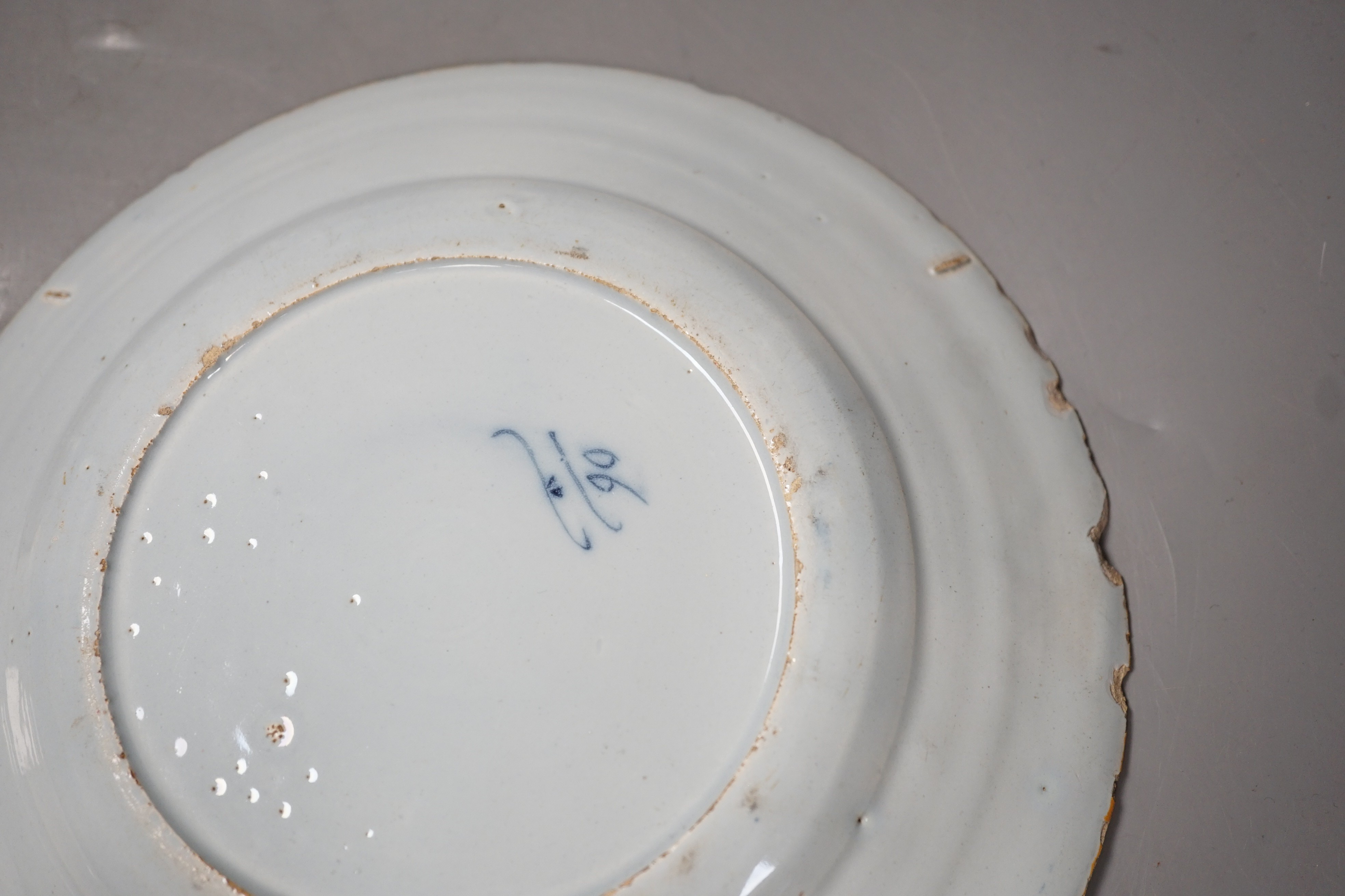 Two 18th century Dutch Delft blue and white plates, largest 23cms diameter